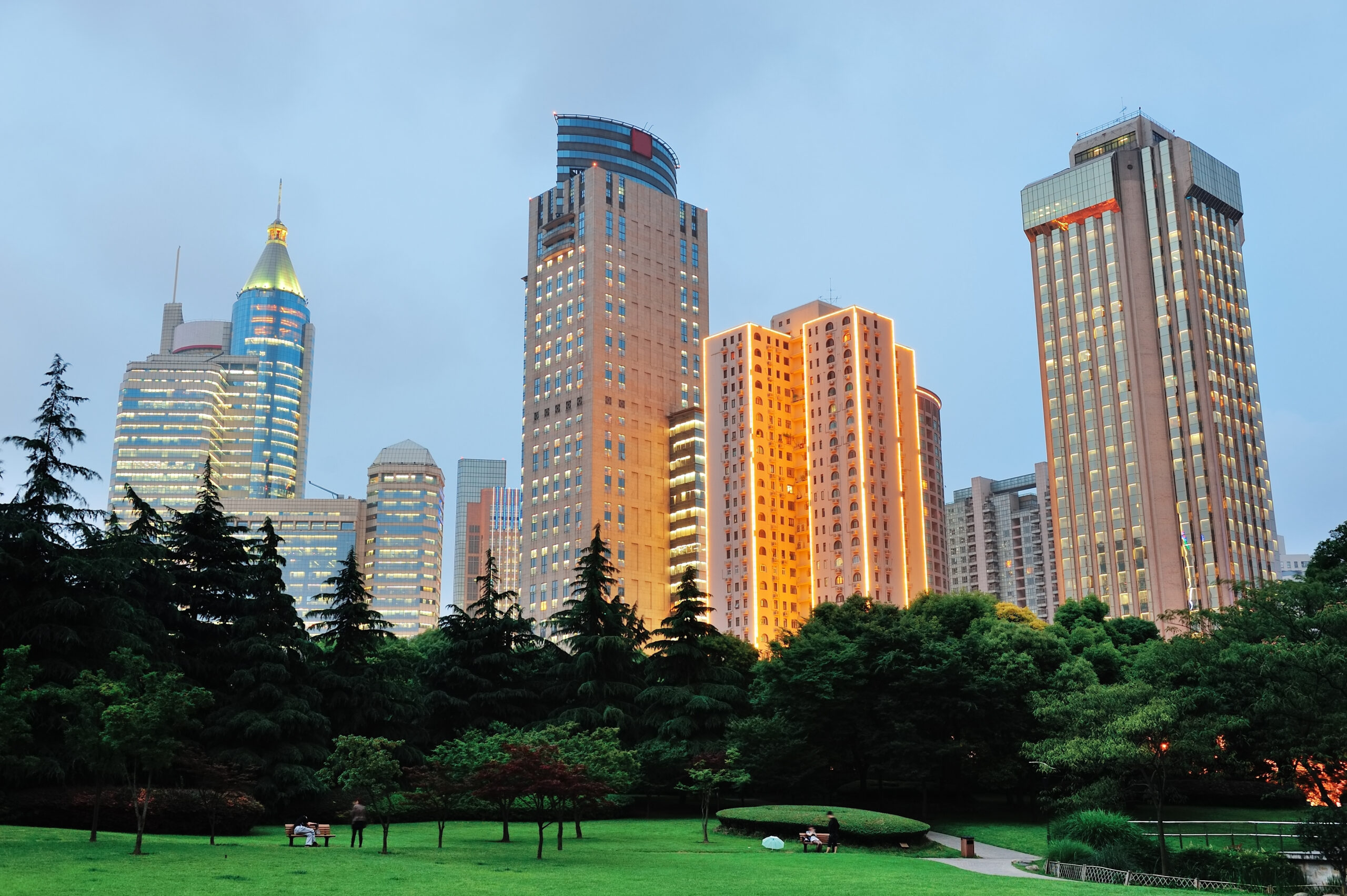 Shanghai urban architecture at dusk in park.